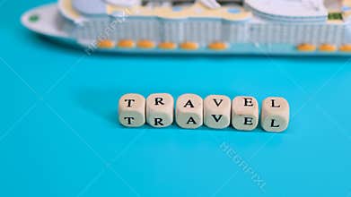Travel concept with objects showing Travel text and ship on blue background