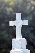 White cross on a cemetery