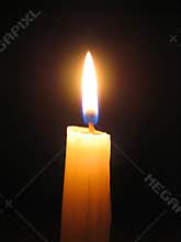 Candle against dark background