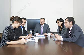 Business People Having Discussion In Conference Room
