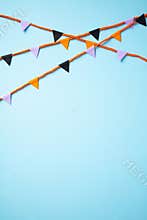 Happy Halloween Bunting on pastel blue background