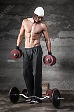 A good looking man lifting weights