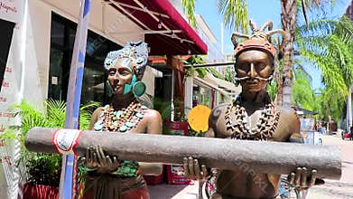 Mayan figures statues sculptures in the tourist street in Mexico