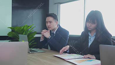 Asian businesswoman presenting data analysis dashboard in meeting. Team business adviser meeting to analyze and discuss