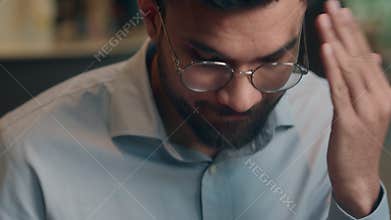 Indian Arabian business man businessman at cafe shock reading bad news cellphone upset receive cancel transaction