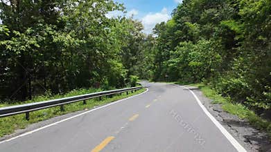 Backpacking trip by motorbike, hyper lapse landscape with winding moutain pass from motorcycle view when moving fast in high speed