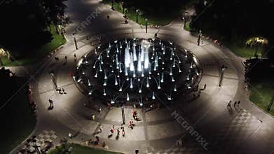 Speedup aerial on fountain in night illumination