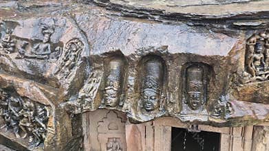 23-7-24 Sculptures carved on rock over the Cave 2 at Kalinjar Fort in India,