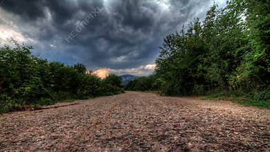 Storm Clouds Over A Mountain Road. HDR Time Lapse Shot Motorized Slider