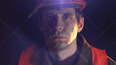 Tired and Dirty Worker in Helmet, Reflecting Hard Labor