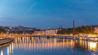 Hyperlapse of the Passerelle du Palais du Justice bridge over the Saone River in Lyon, transition from day to night