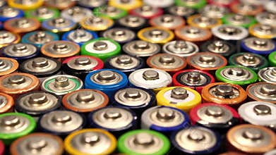 Many multicolored AA batteries shakes