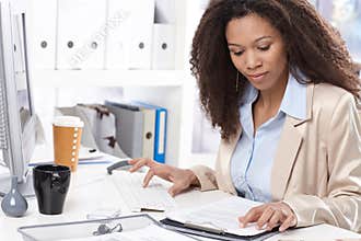 Afro office working busy by working with computer