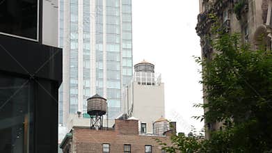 New York City building architecture. Residential house exterior. USA real estate. Rooftop water tower