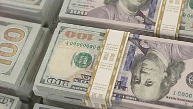 Piles of 100 dollar bill wads