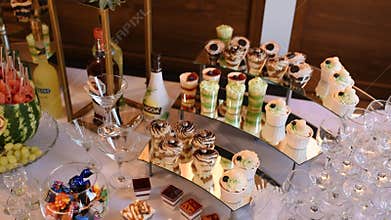 Sweet buffet table candy bar many baking cakes sweets. Desserts in presentation cups