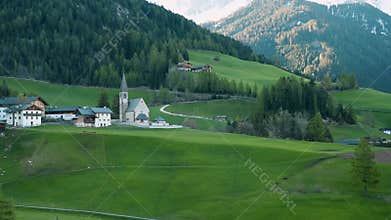 Santa Maddalena village with church in Dolomites mountains, Val Di Funes, Trentino Alto Adige, Italy at sunrise. Alpine