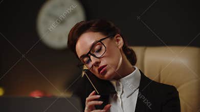 Young successful realtor talking into smartphone about new property buying. Yes, we can help with your contract issues