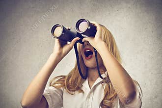 Woman using a binoculars