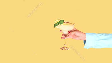 Stop motion. Animation. Young girl in swimming suit and cap jumping into delicious cocktail isolated over yellow
