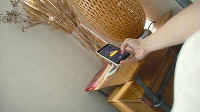 POV woman hands turn off alarm clock on the phone