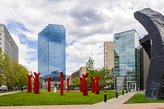 Denver\'s modern skyline with the sculptures in the foreground seen from the Denver Art Museum on a cloudy day