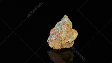 Polished mineral stone lapis lazuli rotates in a circle on a black background