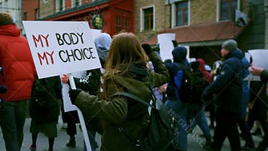 People crowd hold legal safe abortion protest demonstration banners Female right