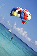 Colorful parasailing. Landing in paradise vacation