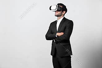 Smart business man crossing arms and standing at white background. Deviation.