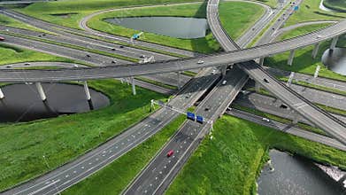 Rotterdam, The Netherlands. Trucks move along a multi-level road junction. The concept of the urban.