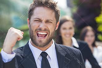 Successful Business Man Celebrating With Female Team