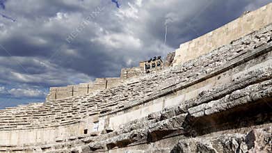 Roman Theatre in Amman, Jordan. Against the sky with clouds. 4K, time lapse