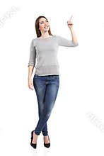 Full body of a standing casual woman pointing at side