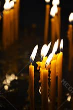 Burning candles in a church