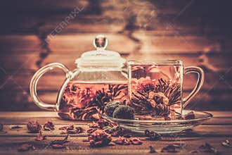 Glass teapot with blooming tea flower