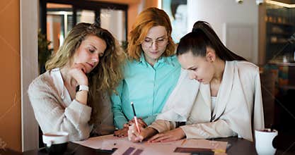 Businesswomen discussing strategies at a modern