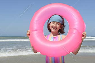 Summer fun portrait: child at the beach