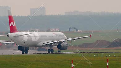 Airbus A321 of Nordwind Airlines taxiing, side view
