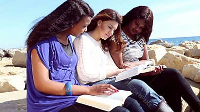 Friends Reading Bible on the Beach