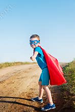 Child acting like a super hero