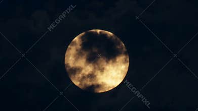 Orange Supermoon in a Cloudy Night