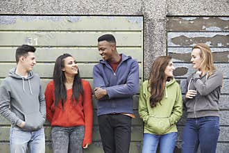 Gang Of Teenagers Hanging Out In Urban Environment