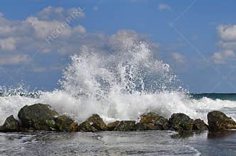 Seascape. Waves show. Summer, sea, sun, beach, rocks, holiday, fun and blue sky - Black Sea, landmark attraction in Romania