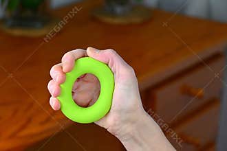 Female hand with silicone grip rubber , forearm workout