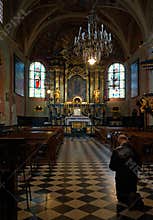 Man pray in St. Mary s Church in Krakow