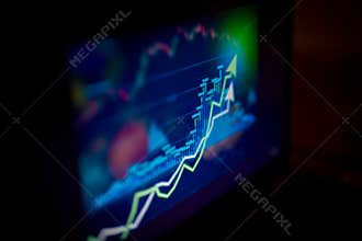 Laptop displaying a business graph