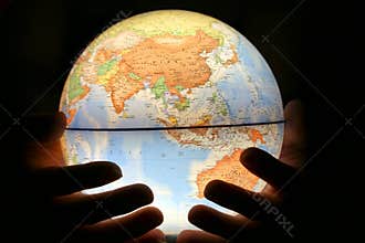 Hand on light globe