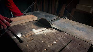 Starting a circular saw on a machine.