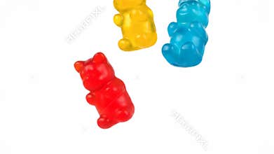Colorful Gummy Bears Falling Against White Background